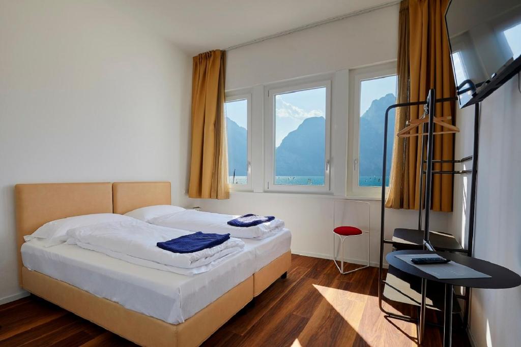 Postel nebo postele na pokoji v ubytování Hotel Paradiso Conca d'Oro