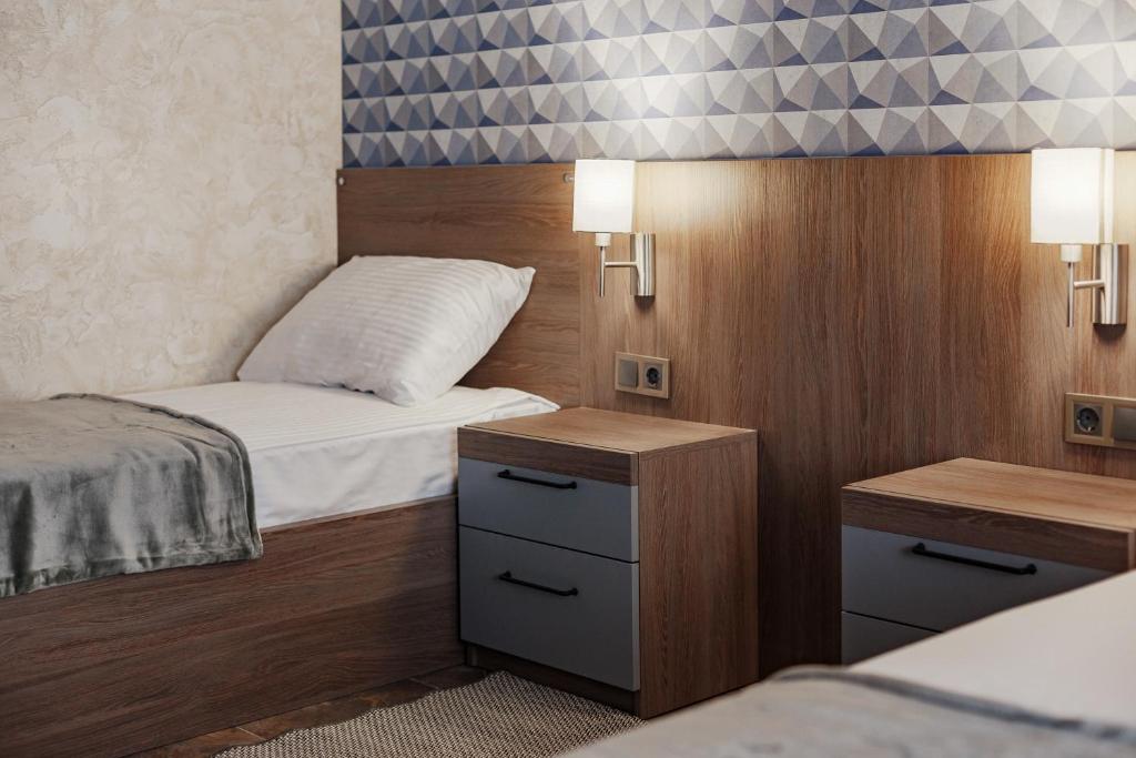 Postel nebo postele na pokoji v ubytování YUDGI - Home Hotel