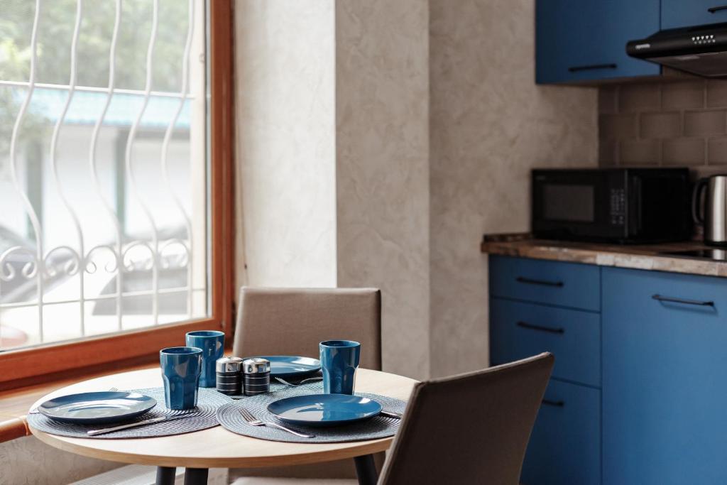 Kuchyň nebo kuchyňský kout v ubytování YUDGI - Home Hotel