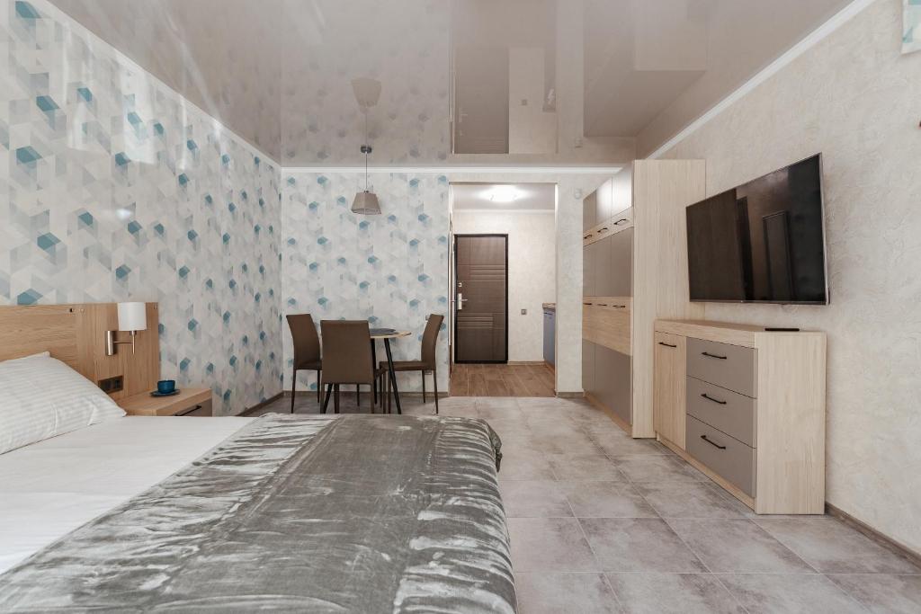 TV a/nebo společenská místnost v ubytování YUDGI - Home Hotel