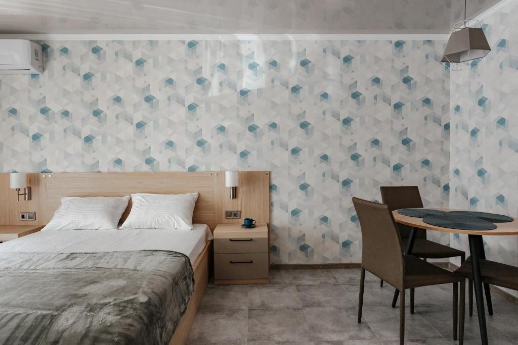 Postel nebo postele na pokoji v ubytování YUDGI - Home Hotel