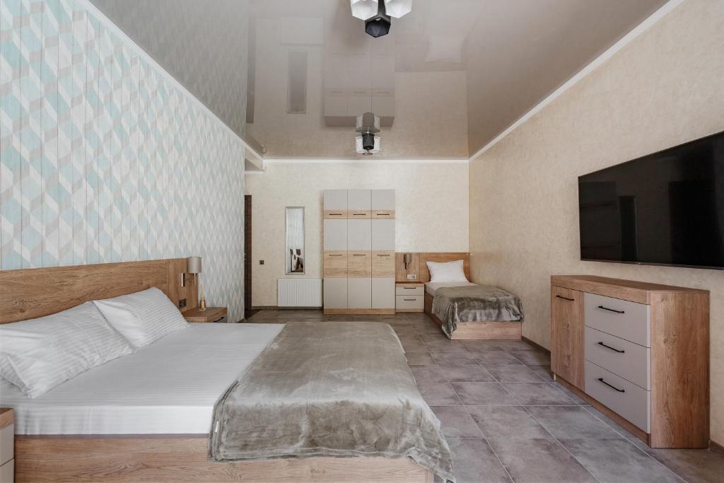 Postel nebo postele na pokoji v ubytování YUDGI - Home Hotel
