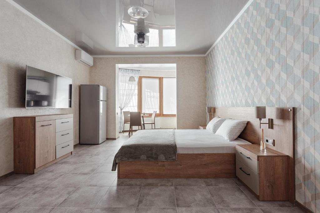 Postel nebo postele na pokoji v ubytování YUDGI - Home Hotel