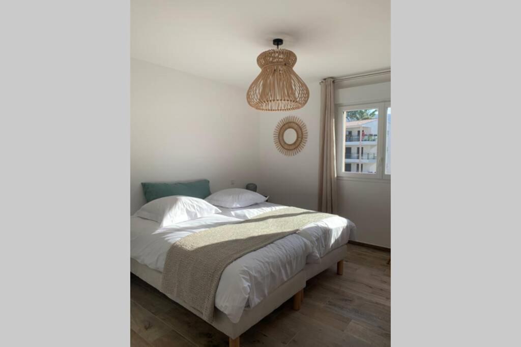 Postel nebo postele na pokoji v ubytování Appartement neuf sur Plage de Calvi Vue Mer