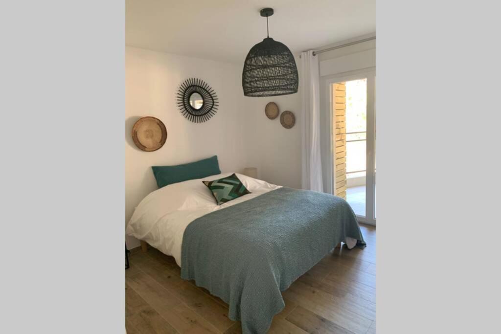 Postel nebo postele na pokoji v ubytování Appartement neuf sur Plage de Calvi Vue Mer