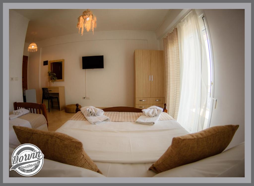 Postel nebo postele na pokoji v ubytování Dorvin Apartments
