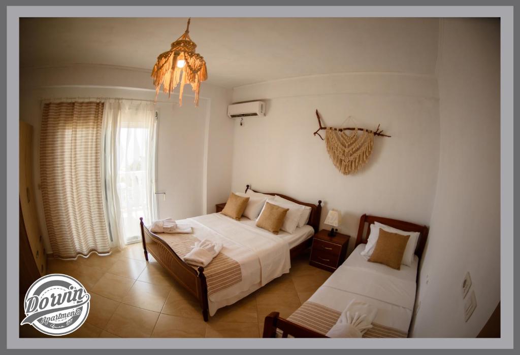 Postel nebo postele na pokoji v ubytování Dorvin Apartments