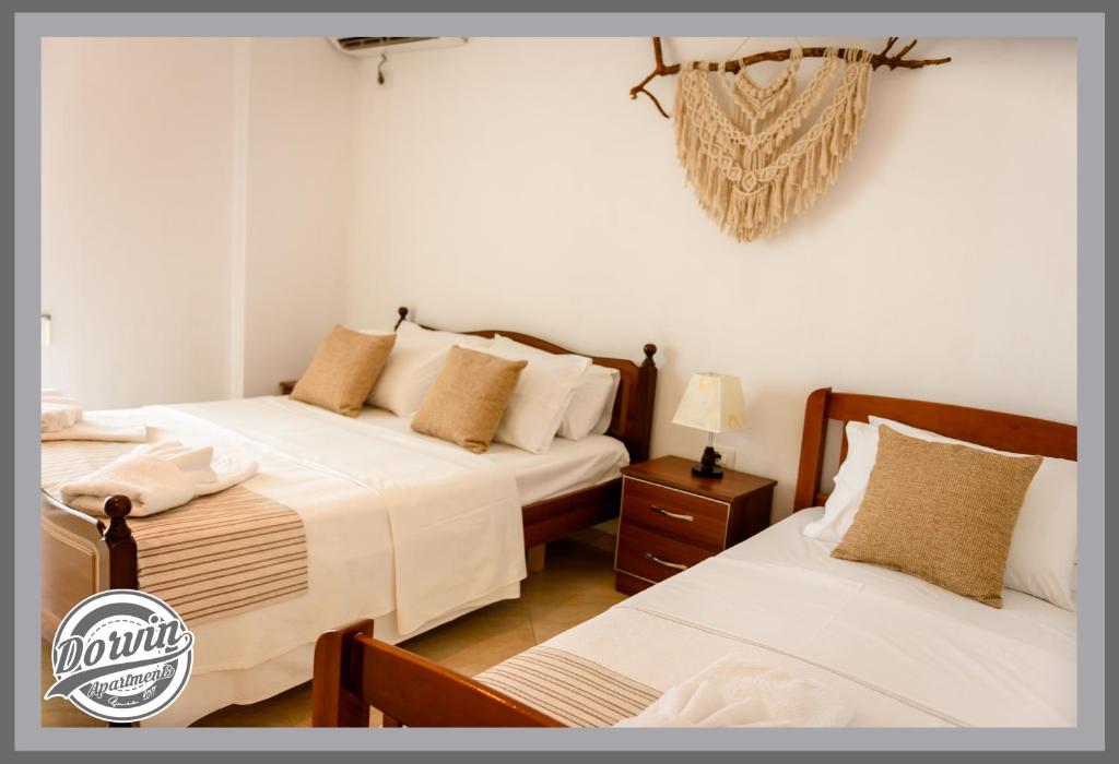 Postel nebo postele na pokoji v ubytování Dorvin Apartments
