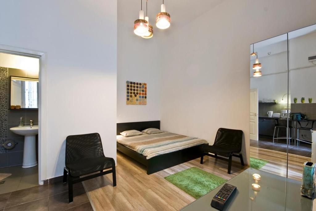 A bed or beds in a room at Balcony Apartment