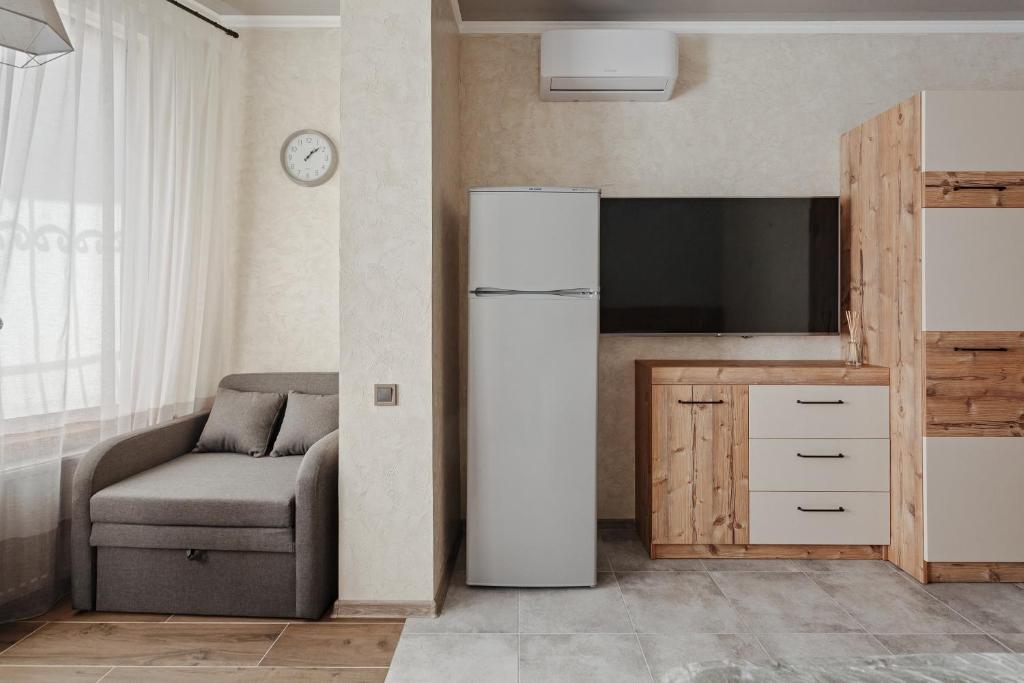 TV a/nebo společenská místnost v ubytování YUDGI - Home Hotel