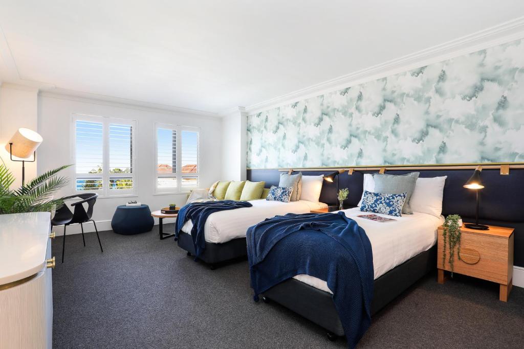 Postel nebo postele na pokoji v ubytování Coogee Bay Boutique Hotel