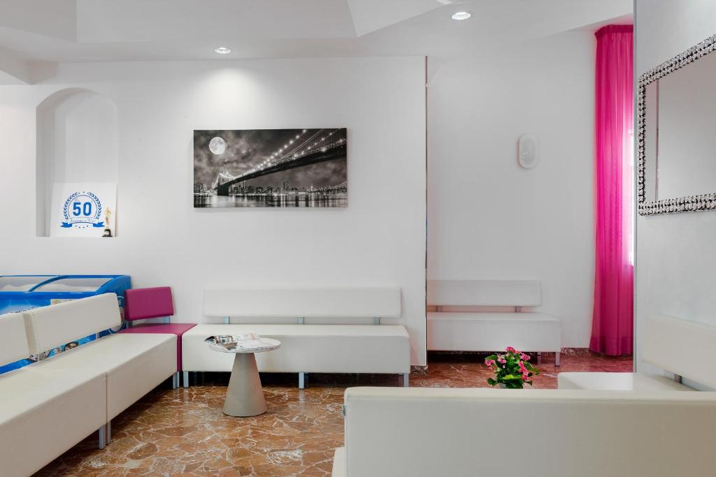 Postel nebo postele na pokoji v ubytování Hotel Très Jolie