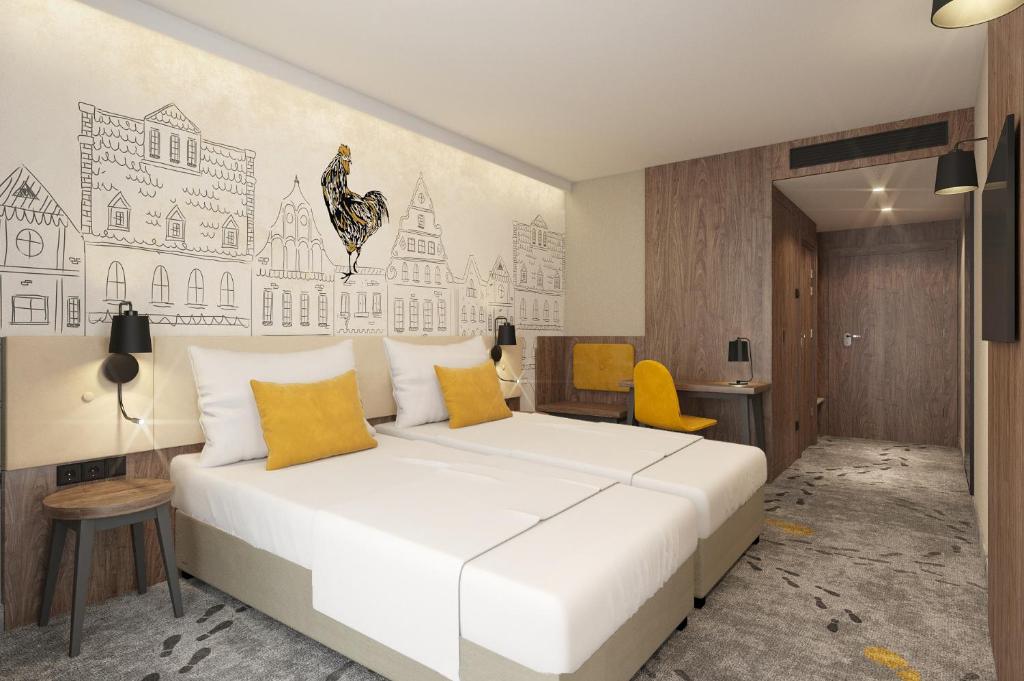 Posteľ alebo postele v izbe v ubytovaní ibis Styles Lublin Stare Miasto