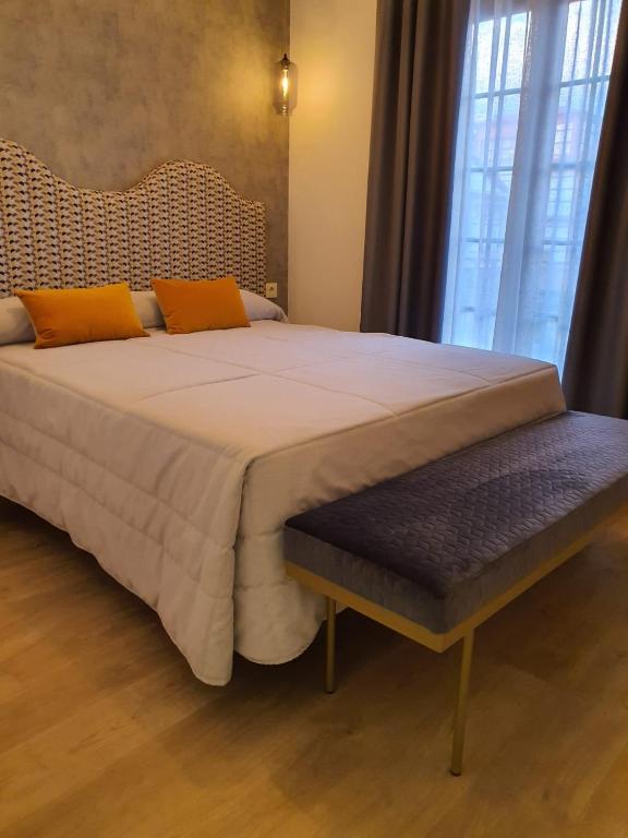 A bed or beds in a room at Hotel Complejo París