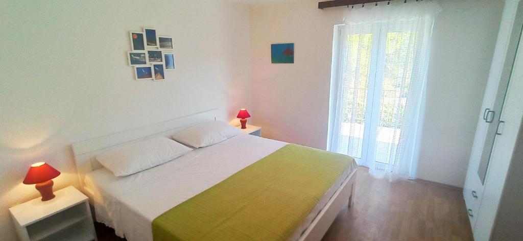 Łóżko lub łóżka w pokoju w obiekcie Apartments Sonija