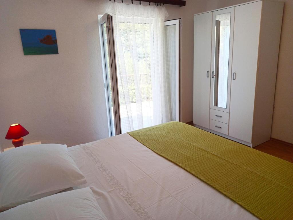 Łóżko lub łóżka w pokoju w obiekcie Apartments Sonija