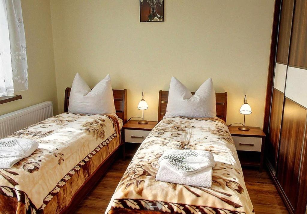 Postel nebo postele na pokoji v ubytování Villa Jura Pokoje Gościnne