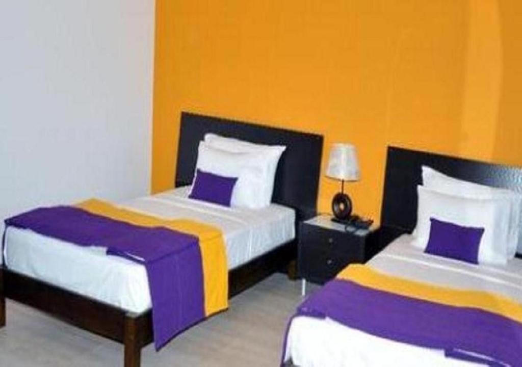 Postel nebo postele na pokoji v ubytování Hotel East Lagoon