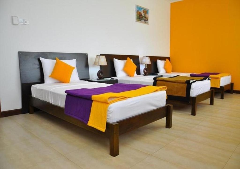 Postel nebo postele na pokoji v ubytování Hotel East Lagoon