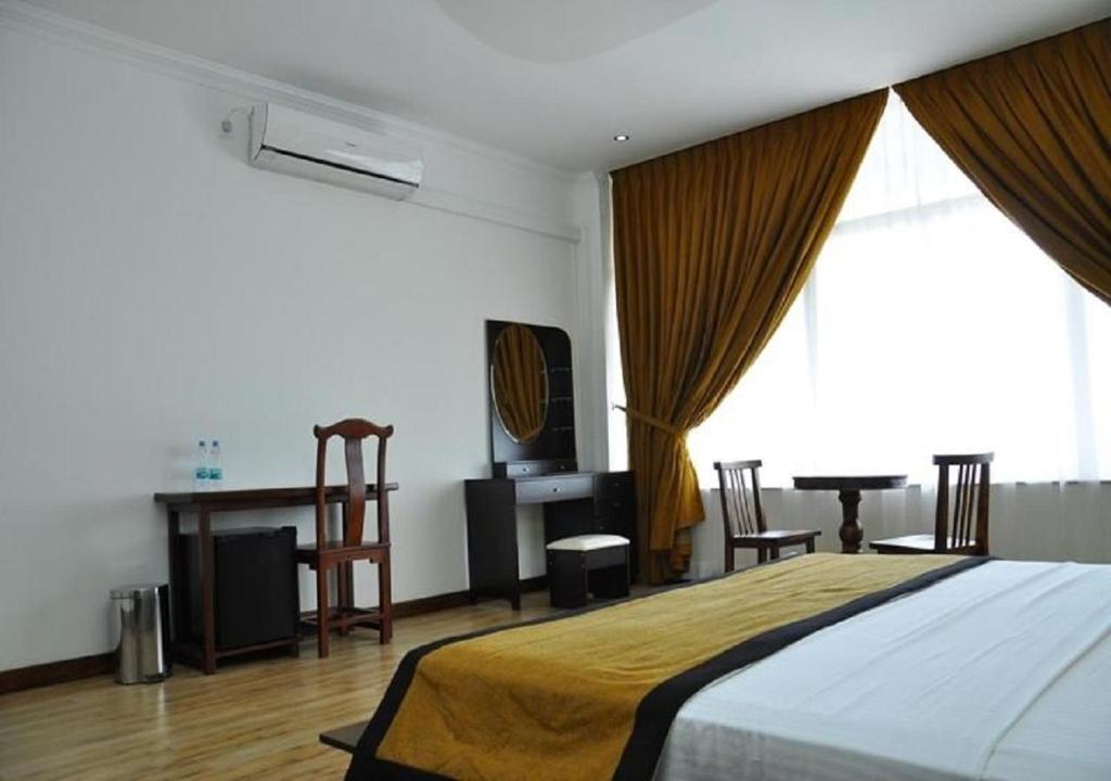 Postel nebo postele na pokoji v ubytování Hotel East Lagoon