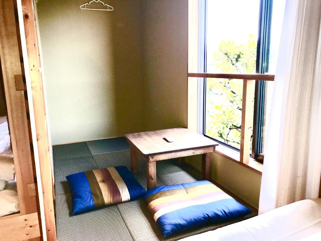 Postel nebo postele na pokoji v ubytování Guest House Kamakura Zen-ji