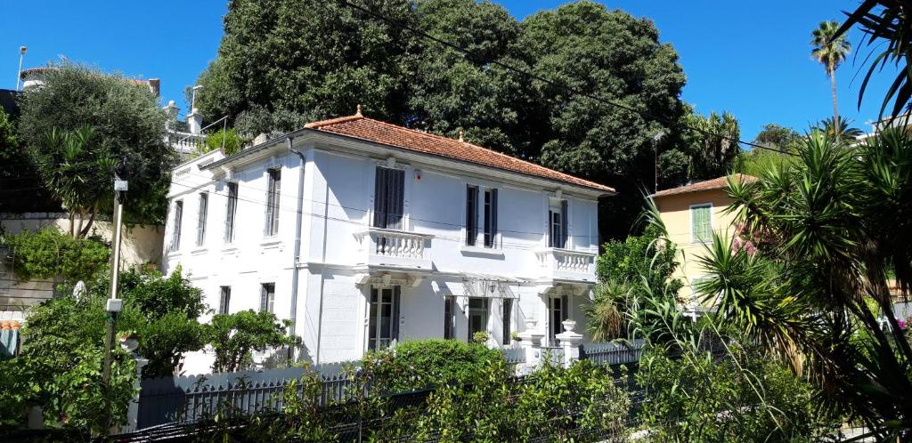 a white house with a red roof at Villa Angelus in Nice