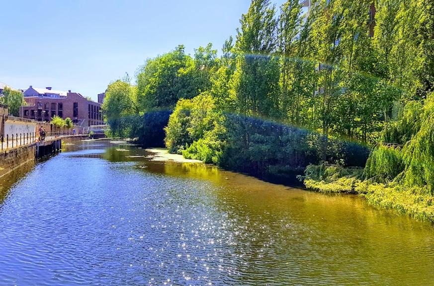 a view of a river from a bridge at Cocoa River - Quiet city centre, close to the Shambles, on the river, two bed, two bath, allocated parking in York