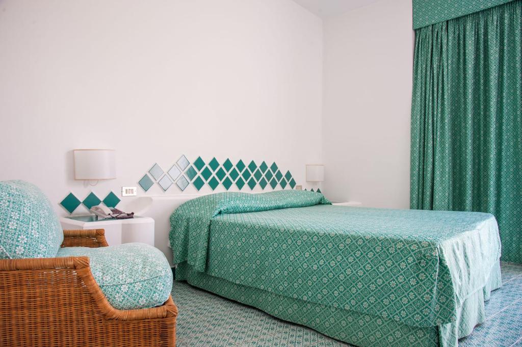 Łóżko lub łóżka w pokoju w obiekcie Hotel Torre Oliva