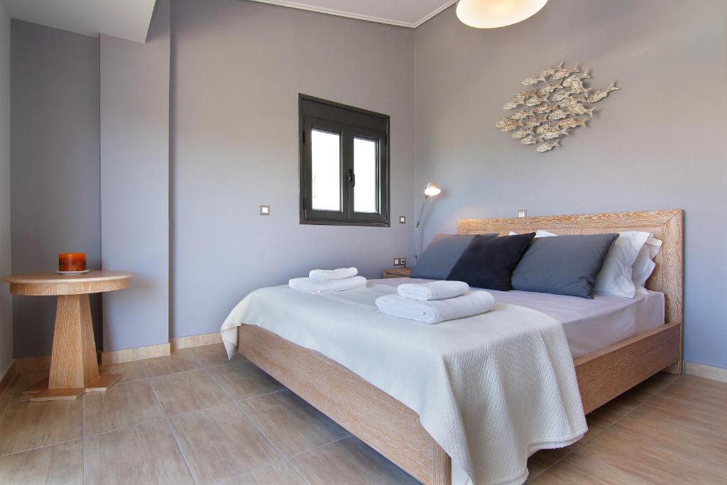 Postel nebo postele na pokoji v ubytování Adam & Eve Villas