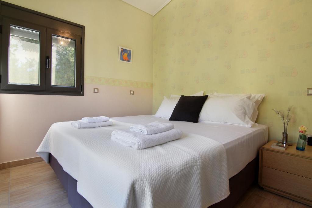 Postel nebo postele na pokoji v ubytování Adam & Eve Villas