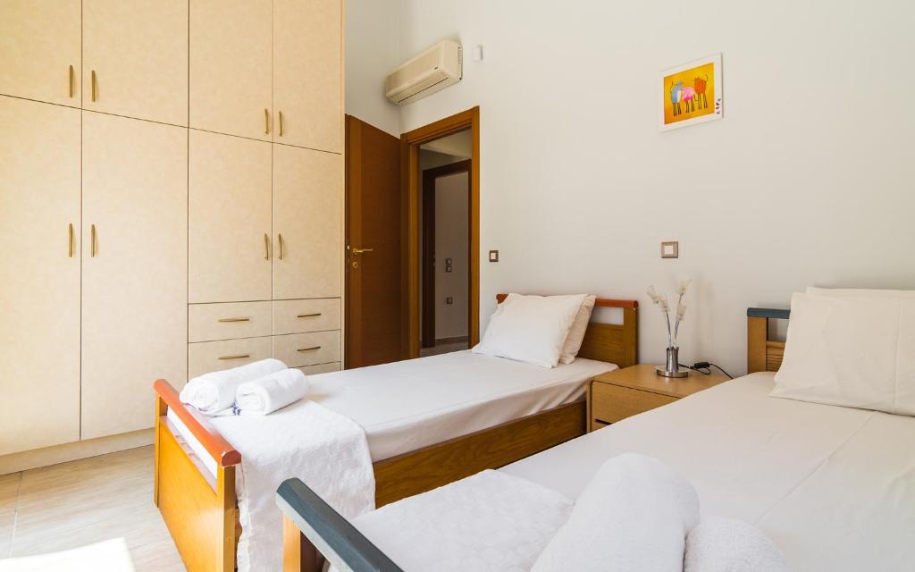 Postel nebo postele na pokoji v ubytování Adam & Eve Villas