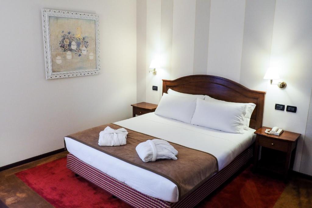 Posteľ alebo postele v izbe v ubytovaní Relais Santo Stefano
