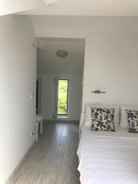 Postel nebo postele na pokoji v ubytování Guesthouse Davorka Bijelić
