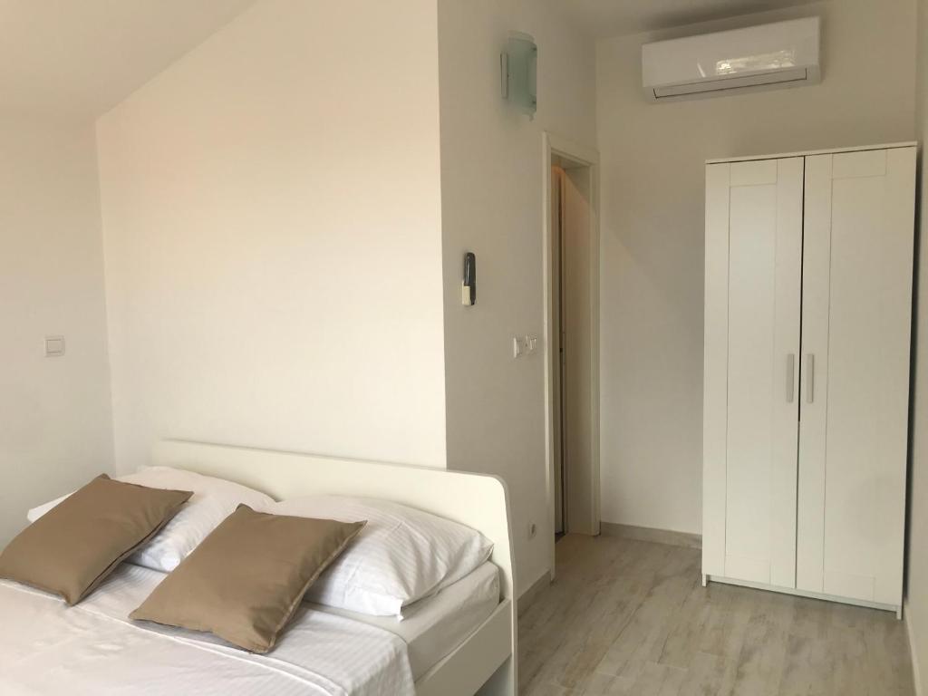 Postel nebo postele na pokoji v ubytování Guesthouse Davorka Bijelić