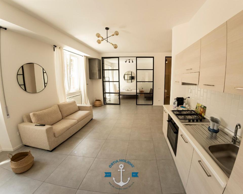 A kitchen or kitchenette at Ostia Holiday Lotito Loft