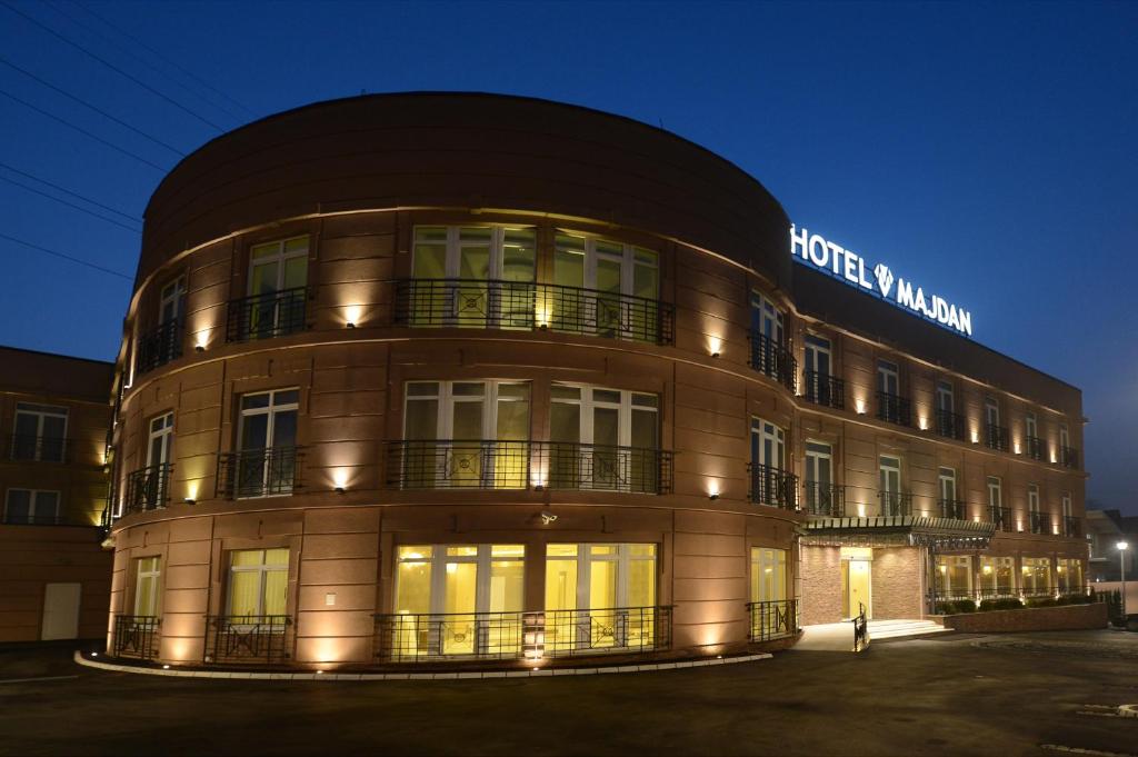 a building with a sign on the front of it at Hotel Majdan in Belgrade