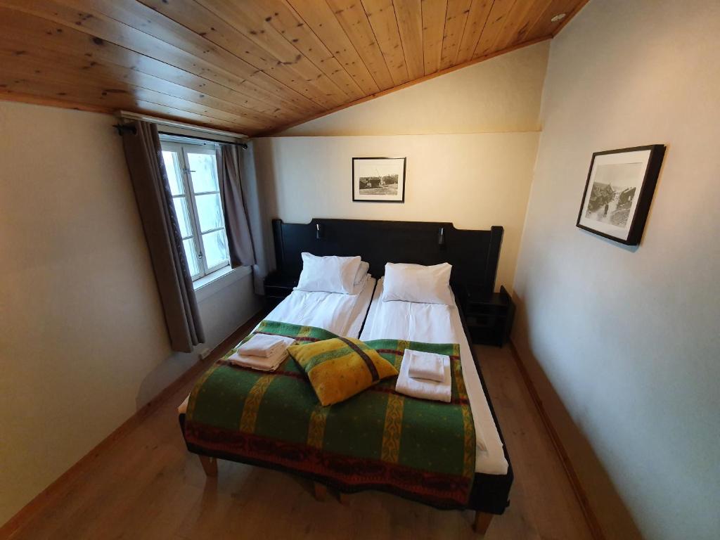 Postel nebo postele na pokoji v ubytování Vertshuset Røros