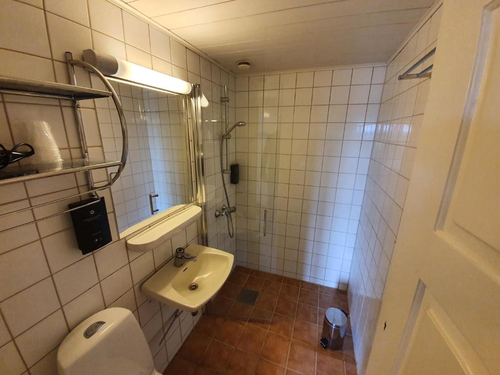 Koupelna v ubytování Vertshuset Røros