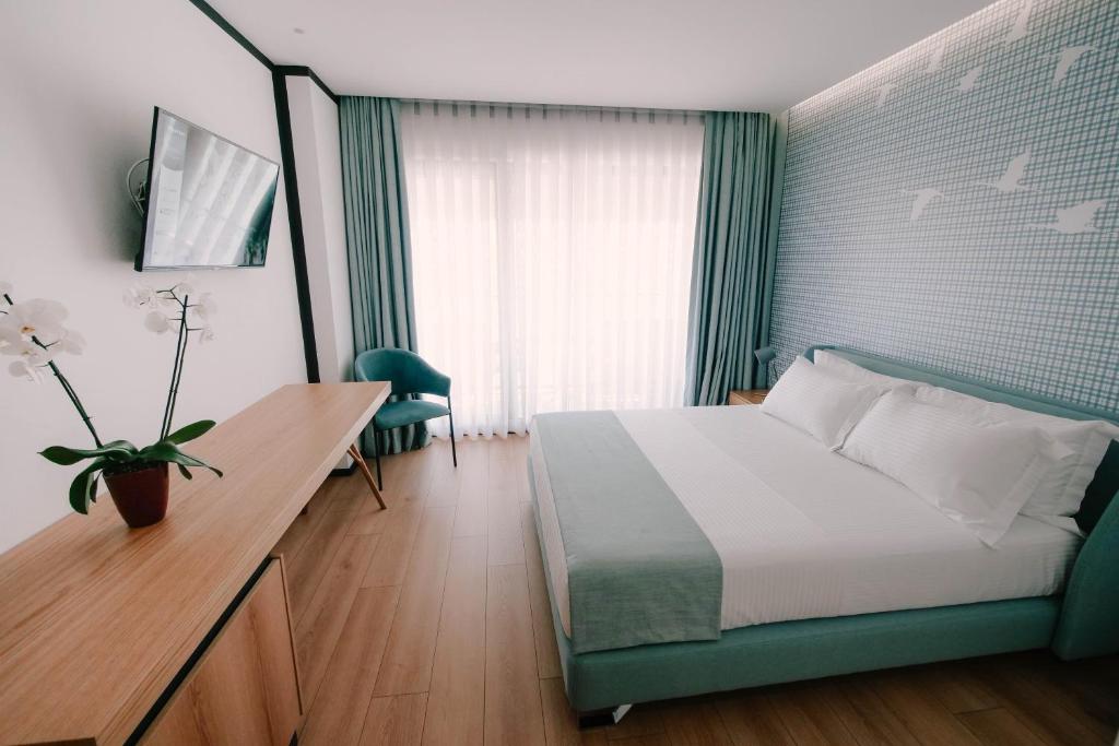 Postel nebo postele na pokoji v ubytování Amara Hotel & SPA