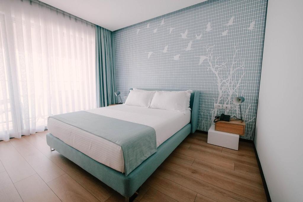 Postel nebo postele na pokoji v ubytování Amara Hotel & SPA