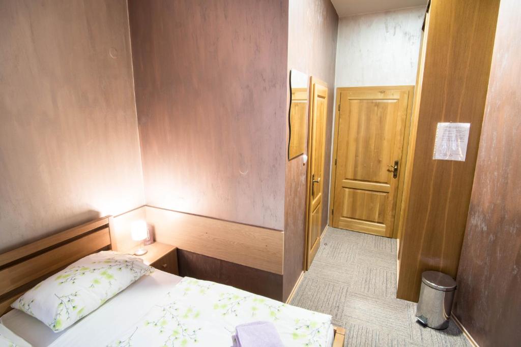 Postel nebo postele na pokoji v ubytování Hotel Šomka