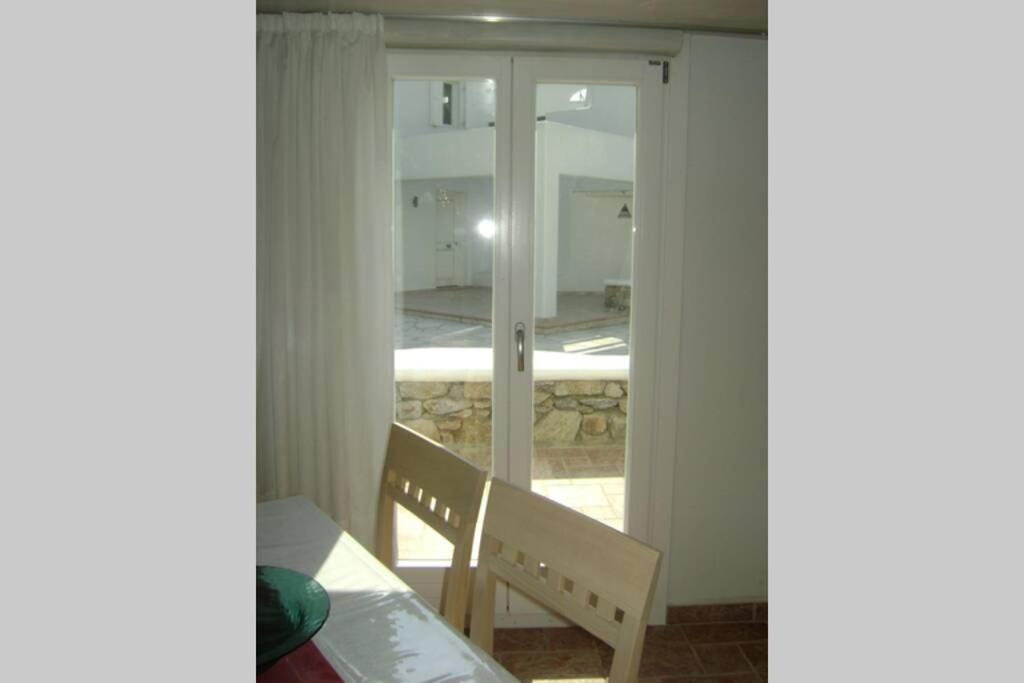 Postel nebo postele na pokoji v ubytování Mykonos Ornos RedOcher Home