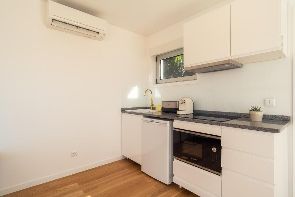 Kuchyň nebo kuchyňský kout v ubytování Casa da Cal - by Casas na Ilha
