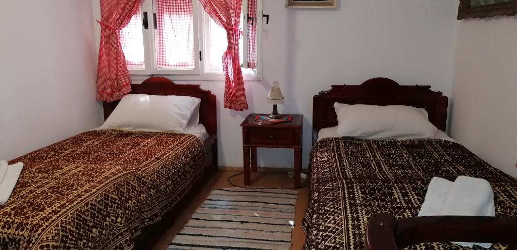 Postel nebo postele na pokoji v ubytování Etno Apartmani ''Vlaška kuća''