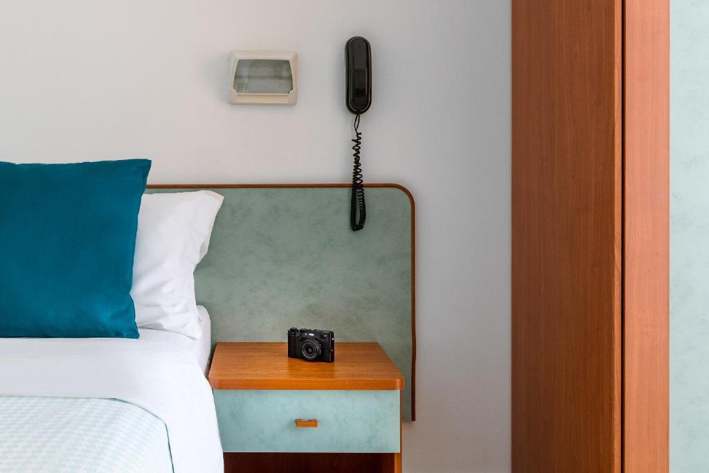 Postel nebo postele na pokoji v ubytování Hotel Très Jolie