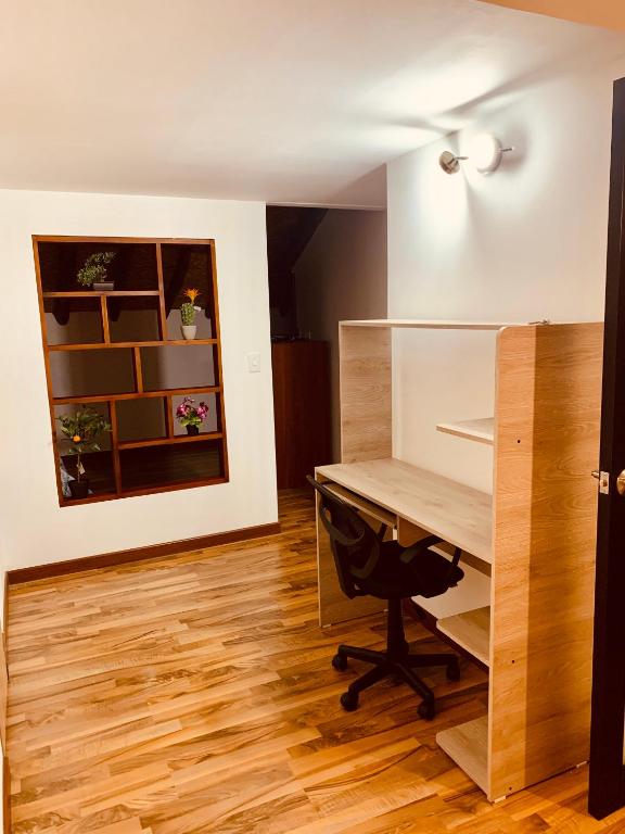Postel nebo postele na pokoji v ubytování Bellísimo chalet en Zona Colonial (301)