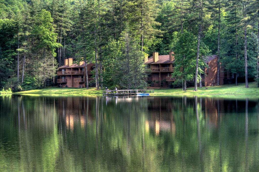 a house on the shore of a lake at Foxhunt at Sapphire Valley by Capital Vacations in Sapphire
