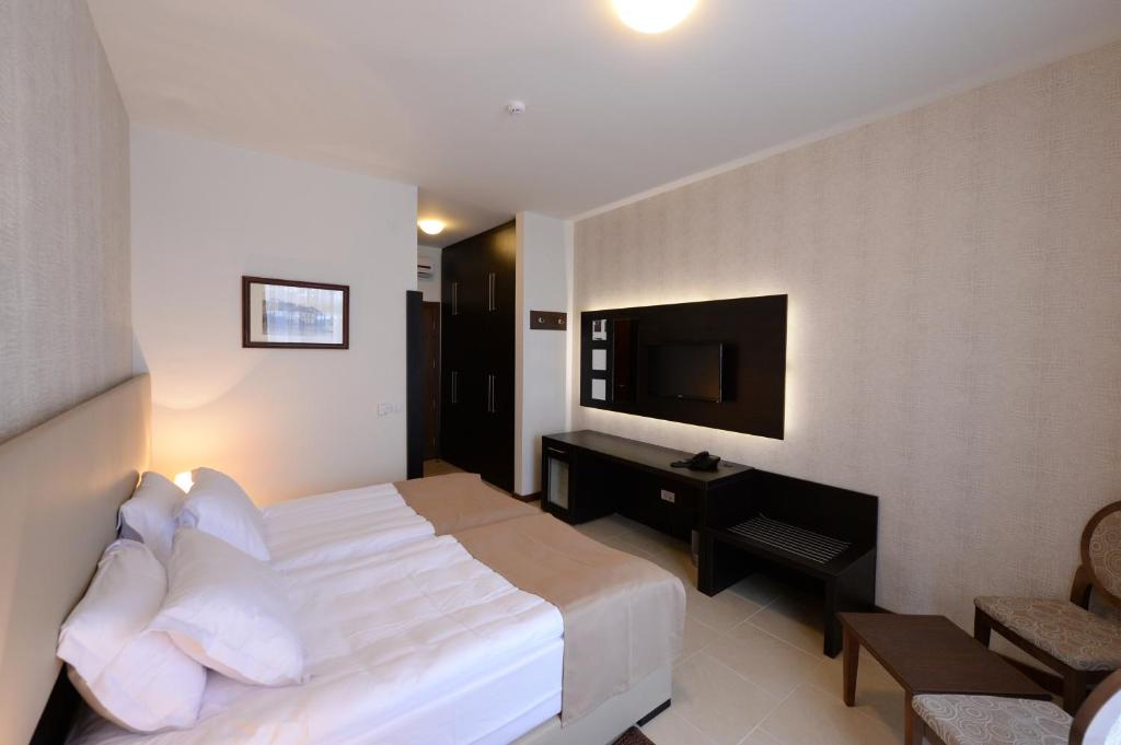 Postel nebo postele na pokoji v ubytování Hotel Majdan