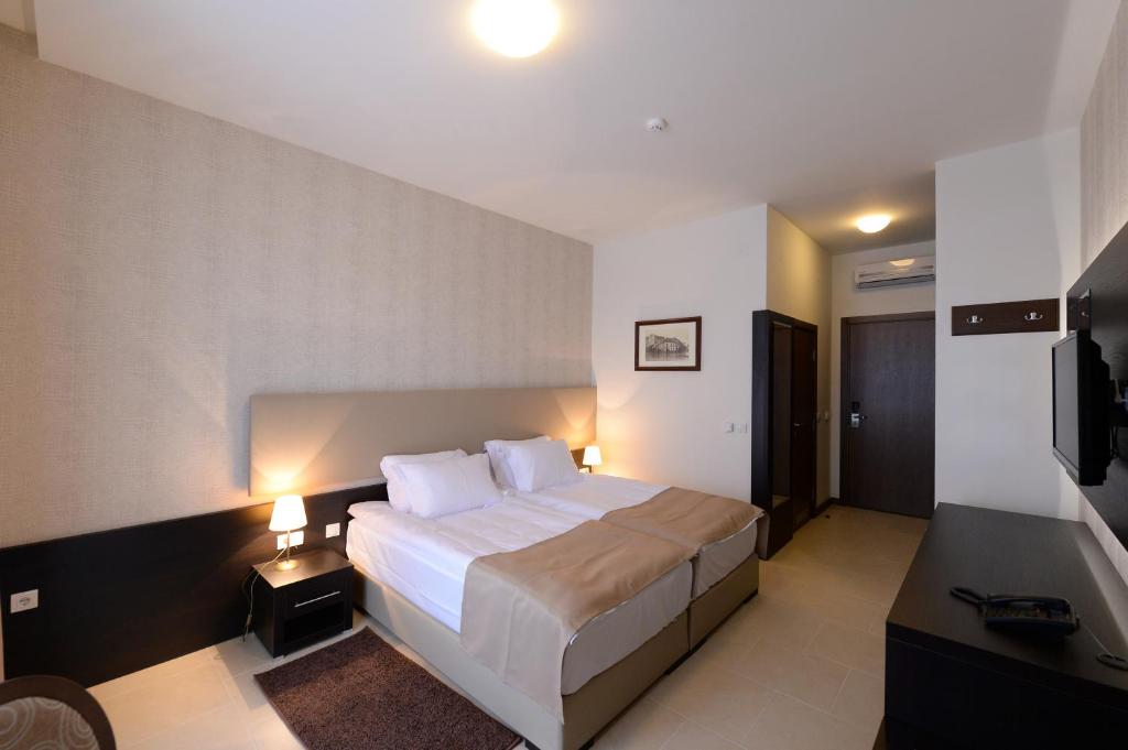 Postel nebo postele na pokoji v ubytování Hotel Majdan