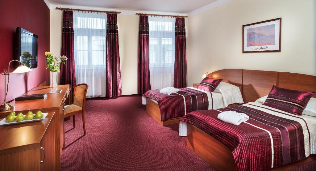 Postel nebo postele na pokoji v ubytování Reitenberger Spa Medical